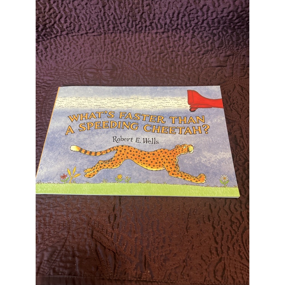 Whats‎ Faster Than a Speeding Cheetah? by Wells, Robert Paperback 1997 Like New